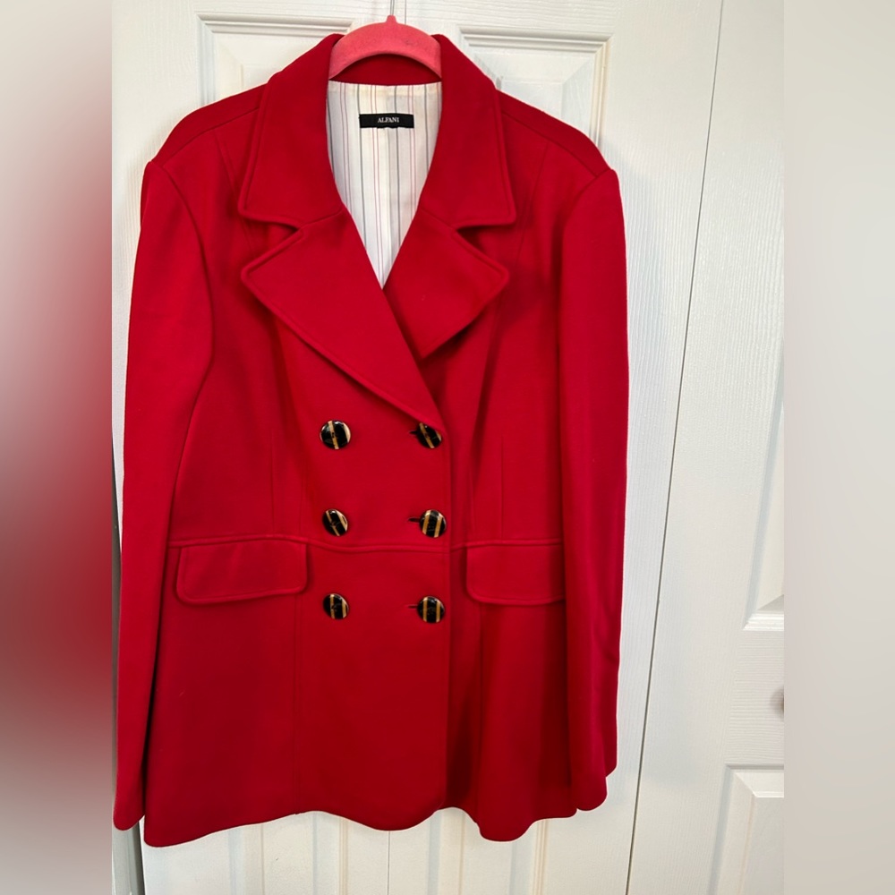 Beautiful red jacket with brown buttons and faux front pockets, fully lined.